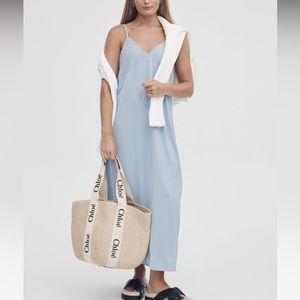 Legos heritage satin slip dress in sky blue.